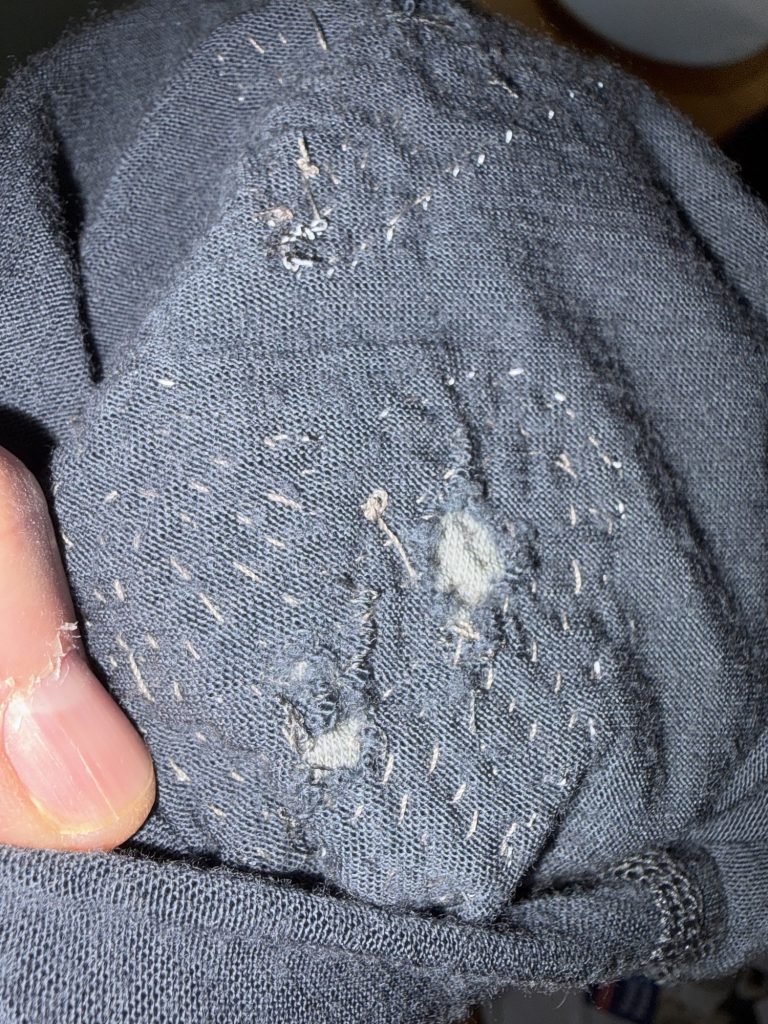 I'm open for business and the back side of these heart shaped hole patches show the detailed sewing I do. 