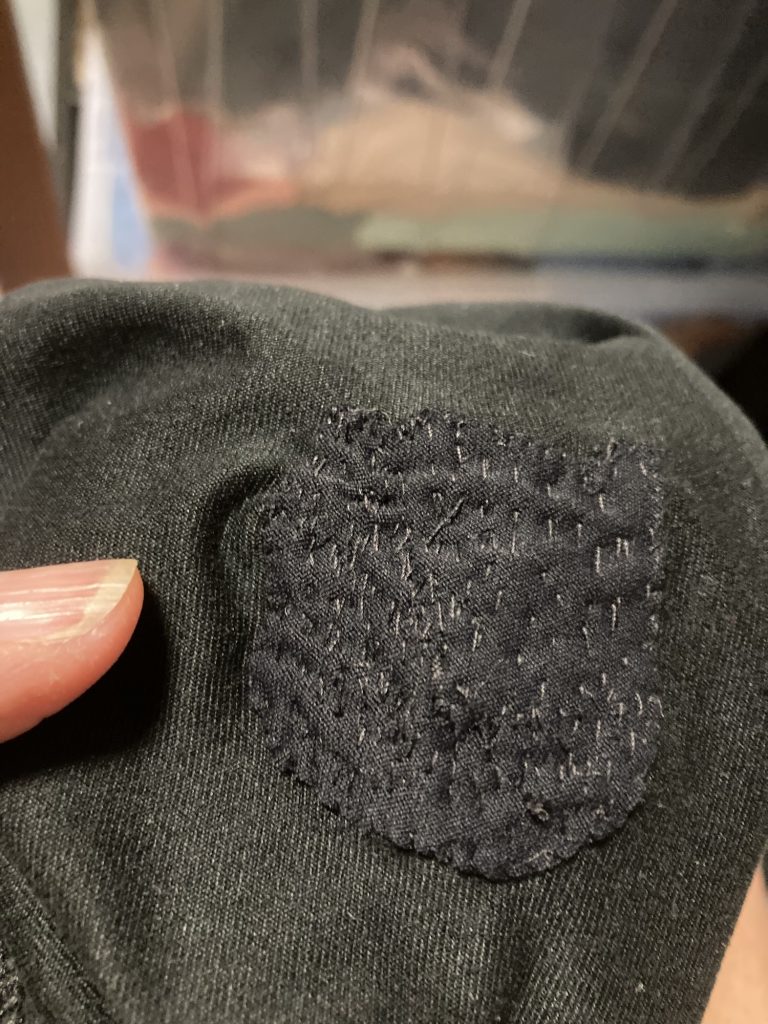 Running tights with a large hole patch, seen from the inside of the tights