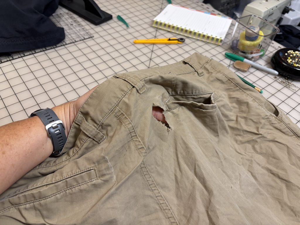 A rip in a pair of shorts 