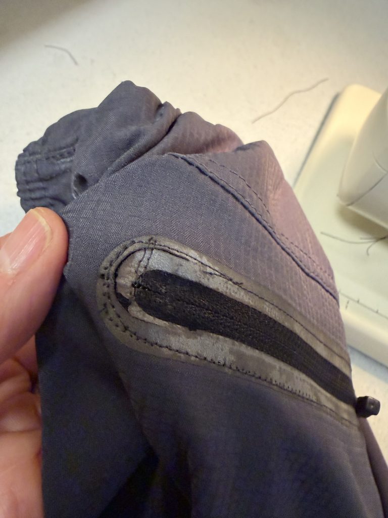 The zipper portion of the pocket was ripping out, so it was secured into place. 
