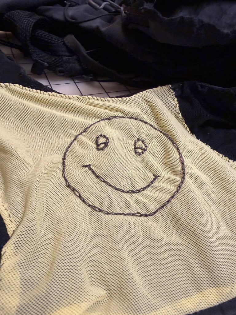 The power mesh repair with my dorky smiley face design. 